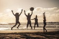 Sunset at the beach with happy group of young people jumping having fun - friends on summer holiday vacation enjoying together in Royalty Free Stock Photo