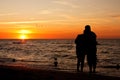 Sunset on a beach - Love couple silhouette Royalty Free Stock Photo