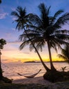 sunset on the beach with palm tree and hammock, Koh Mak Island Thailand Royalty Free Stock Photo