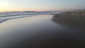 Sunset beach pan and fly by with birds 4k