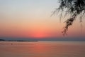 Sunset on the beach at Peraia, suburb of Thessaloniki, Greece. View of the promenade, golden sky and sea. Royalty Free Stock Photo