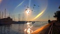 Sunset   in Harbor water wave reflection sky scape seascape   sea stone birds on sky  light sun boat and yaht in port colorful  su Royalty Free Stock Photo