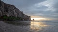 Sunset beach reflections at Morro Rock on the central coast of California at Morro Bay California USA Royalty Free Stock Photo