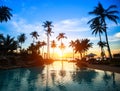 Sunset at a beach resort in tropics. Royalty Free Stock Photo