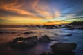 Sunset on the beach with rock islet Royalty Free Stock Photo