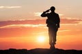 Soldier Saluting During Sunset Royalty Free Stock Photo