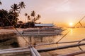 Sunset on the beach with silhouette of banca boat at Panglao Island, Bohol, Philippines Royalty Free Stock Photo