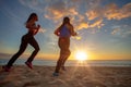 Sunset beach two fit girls jogginr on sand