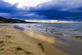 Sunset on beach on Tyrrhenian Sea, Mediterranean Sea - Cefalu, Sicily, Italy Royalty Free Stock Photo