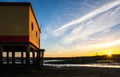 Sunset beach view of the historical life-guard building in Fuseta, Ria Formosa Natural park, Portugal. Royalty Free Stock Photo
