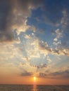 Sunset beams clouds sun blue and orange golden colors greece