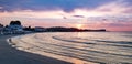 Sunset In A Beautiful Beach With waves and sand.