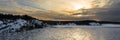 Sunset. Beautiful view of the northern snow covered shores of Scandinavia, Baltic sea at sunset Royalty Free Stock Photo