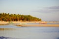 Sunset on beautiful white coral sand beach with palms Royalty Free Stock Photo