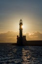 Sunset behind an ancient stone lighthouse Veneitian Port, Chania, Crete Royalty Free Stock Photo