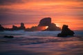 Sunset behind arch at Oregon coast USA Royalty Free Stock Photo