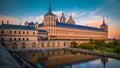 The monastery and royal place El Escorial in Spain at sunset with reflection in a pond Royalty Free Stock Photo