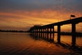 Sunset behind bridge Royalty Free Stock Photo