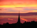 Sunset behind church tower Royalty Free Stock Photo