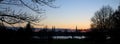 Sunset behind the church towers of Luebeck, northern Germany Royalty Free Stock Photo