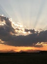 Sunset behind clouds over mountains 3