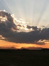 Sunset behind clouds over mountains 4 Royalty Free Stock Photo