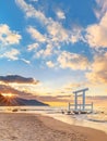 Sunset behind the coast of the Itoshima Beach in Fukuoka whith a white Shinto torii gate in the sea. Royalty Free Stock Photo