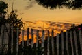Sunset behind a fence Royalty Free Stock Photo