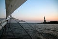 The sunset behind Lady Liberty from an historical vessel Royalty Free Stock Photo