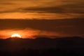 Sunset behind mountain and cloud Royalty Free Stock Photo