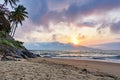 Sunset behind the mountains on a beach on Ilhabela Island