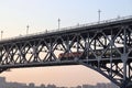 Sunset behind Nanjing Yangtze River Bridge with a train passing through the bridge