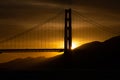 Sunset behind the north tower of the Golden Gate Bridge in San Franciscco Royalty Free Stock Photo