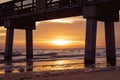 Sunset behind the pier of Fort Myers Beach, Florida Royalty Free Stock Photo