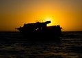 Sunset behind shipwreck near cape agulhas