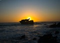 Sunset behind shipwreck near cape agulhas