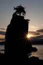 Sunset behind Siwash rock in Stanley park Vancouver Canada Royalty Free Stock Photo