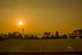 Sunset behind the sky, orange sky, unset at city of Chiangmai with building silhouette