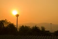 Sunset behind the sky, orange sky, unset at city of Chiangmai with building silhouette