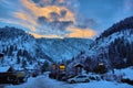 Sunset behind snowy mountain