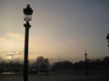 A sunset behind some gorgeous Parisien street lamps with the Eiffel Tower in the background, Paris