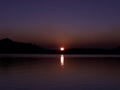 Sunset behind the tree at Waldo Lake is a natural alpine lake in the Cascade Mountains of the U.S. state of Oregon