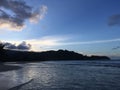 Sunset behind Waioli Streem Entering Pacific Ocean in Hanalei Bay on Kauai Island, Hawaii. Royalty Free Stock Photo