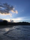 Sunset behind Waioli Streem Entering Pacific Ocean in Hanalei Bay on Kauai Island, Hawaii. Royalty Free Stock Photo