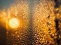 Sunset behind the window glass with raindrops Royalty Free Stock Photo