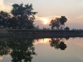 Sunset besides a beautiful pond in rural area of Cuttack , India. Royalty Free Stock Photo