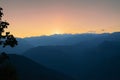 Sunset beyond layers of Himalayan mountain range Royalty Free Stock Photo