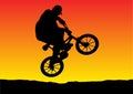 Sunset biker jumping