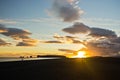 Sunset on black beach with Dyrholaey rock in background,Iceland