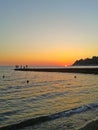 Sunset on the Black Sea, the fishermen on the pier, coast Sochi, Russia Royalty Free Stock Photo